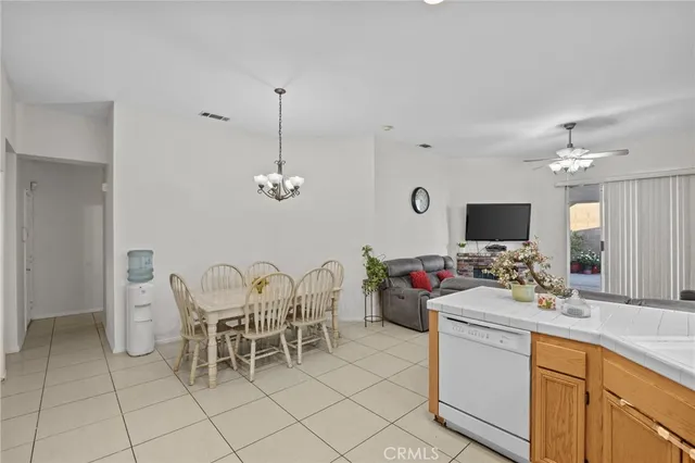a view of a dining room furniture and chandelier