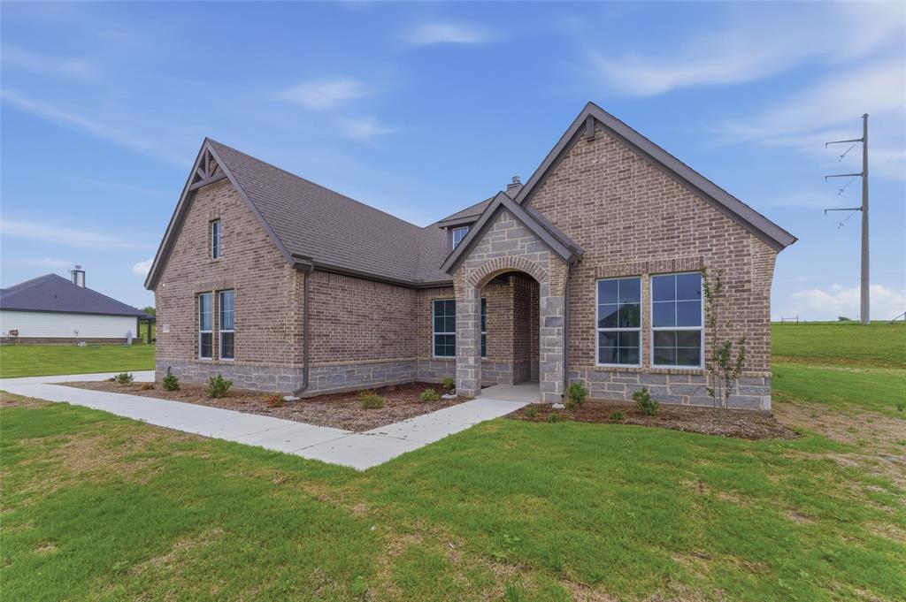 119 Hillview Trail Decatur, TX 76234 - Photo 2 of 30 Brick exterior with stone accents and an arched entryway