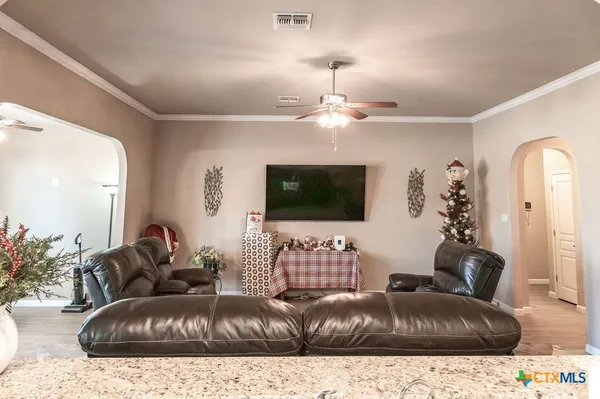 a living room with furniture and a flat screen tv