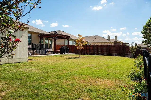 a view of a bedroom with furniture and wooden floor