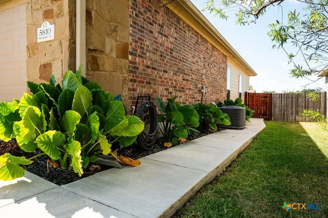 a view of a livingroom with furniture and a window
