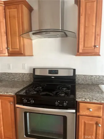 a close view of a stove and a microwave oven