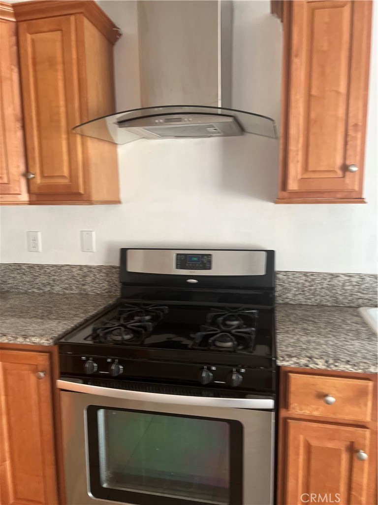 42901 Alep Street Lancaster, CA 93536 - Photo 14 of 17 a close view of a stove and a microwave oven