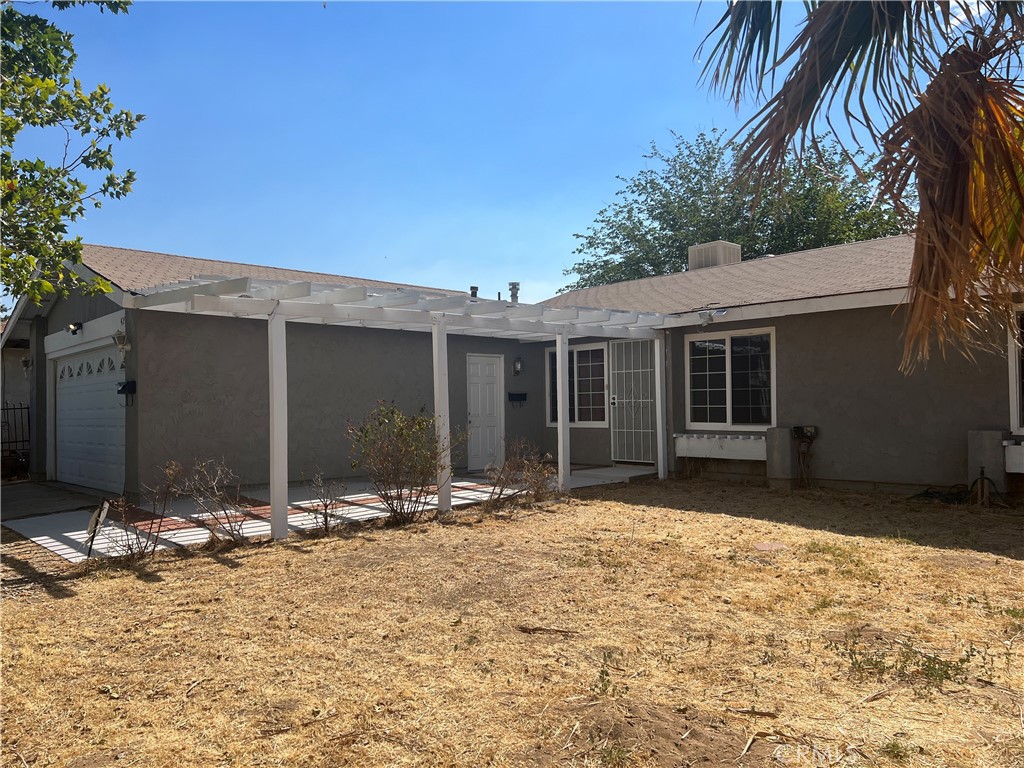 42901 Alep Street Lancaster, CA 93536 - Photo 17 of 17 a front view of a house with a yard