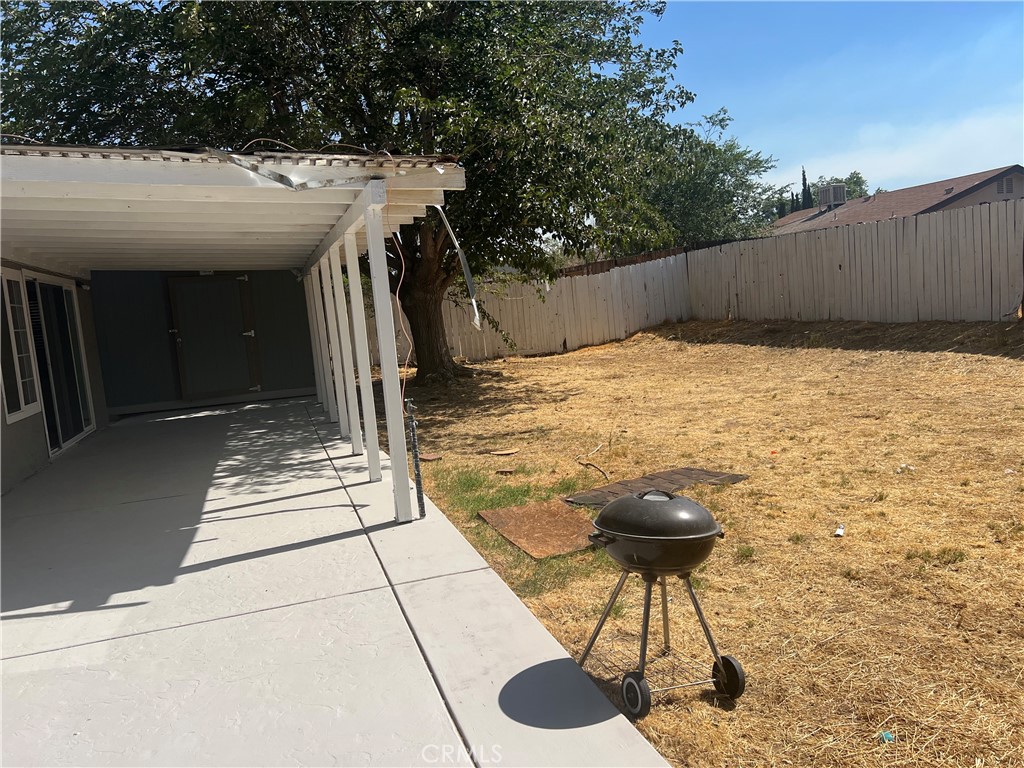 42901 Alep Street Lancaster, CA 93536 - Photo 3 of 17 a backyard of a house with table and chairs