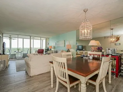 a spacious bedroom with a bed and a cabinets