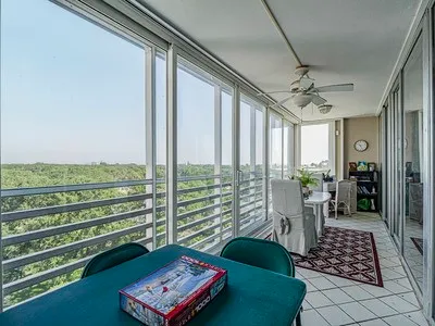 a front view of a house with outdoor seating