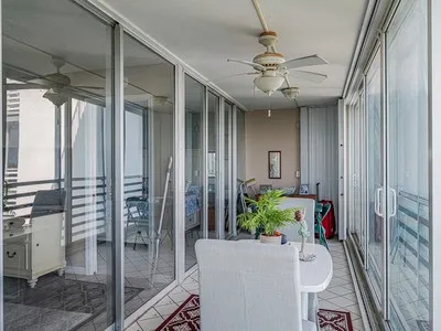 a view of a balcony with an ocean view