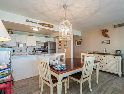 a kitchen with a stove a sink and a refrigerator