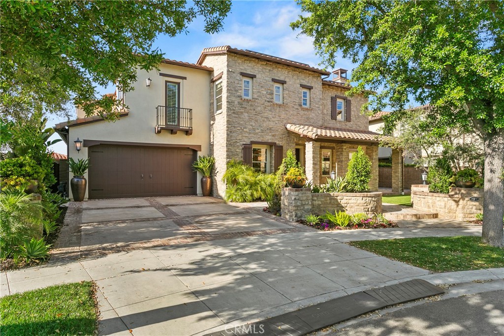 7 Kent Court Ladera Ranch, CA 92694 - Photo 1 of 49 a front view of a house with a yard and potted plants