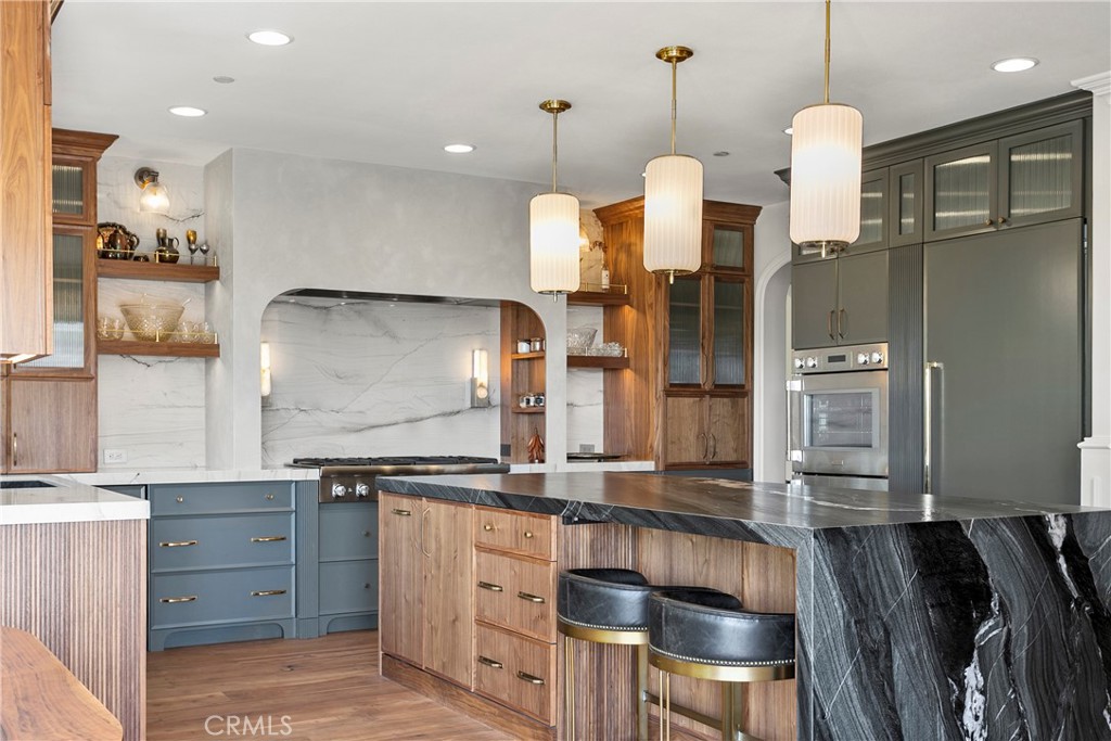 7 Kent Court Ladera Ranch, CA 92694 - Photo 12 of 49 a kitchen with a sink stainless steel appliances and cabinets