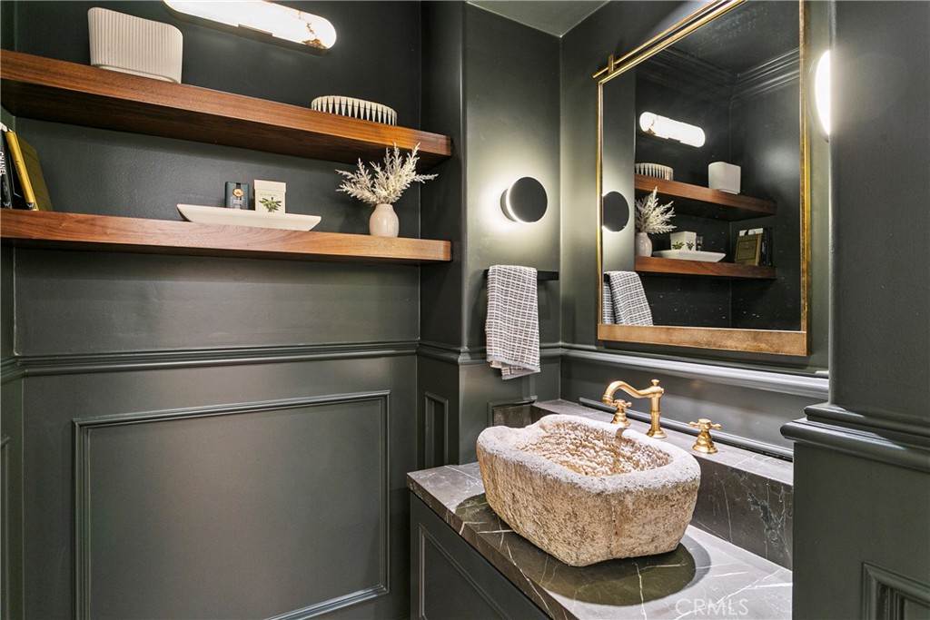 7 Kent Court Ladera Ranch, CA 92694 - Photo 20 of 49 a bathroom with a sink and a mirror