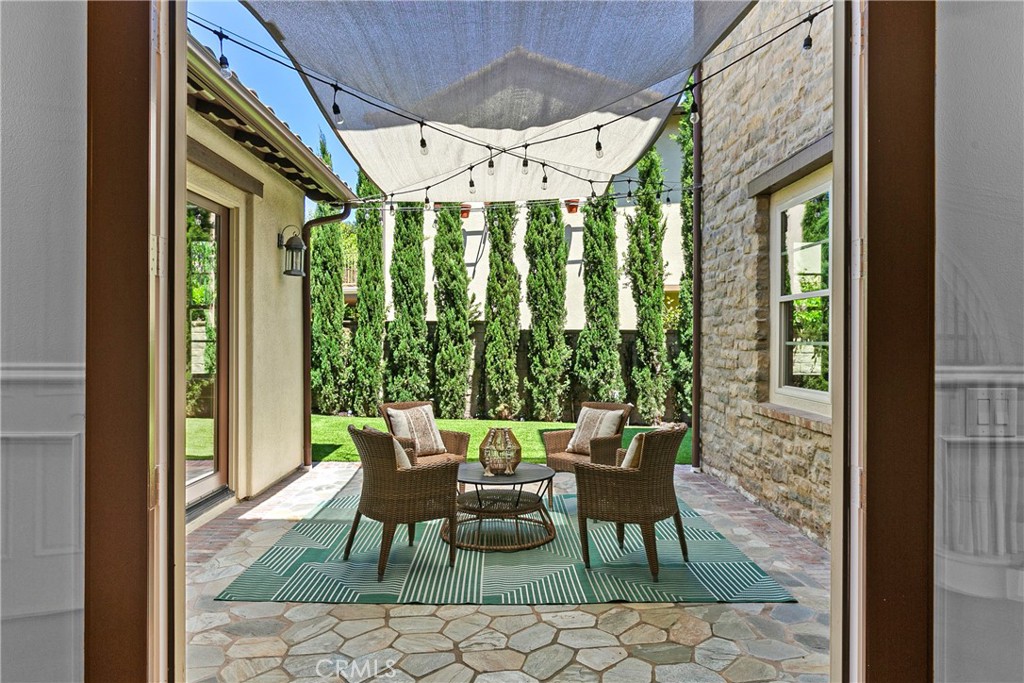 7 Kent Court Ladera Ranch, CA 92694 - Photo 24 of 49 a view of an outdoor dining space with a table and chairs