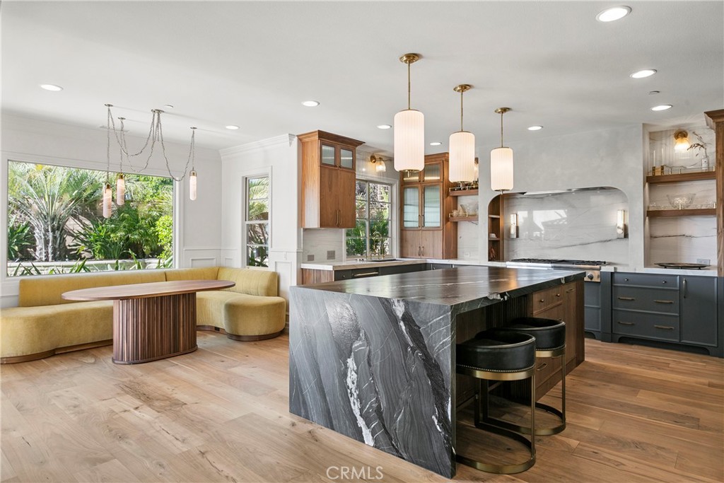 7 Kent Court Ladera Ranch, CA 92694 - Photo 4 of 49 a kitchen with stainless steel appliances granite countertop a sink a stove and a wooden floors