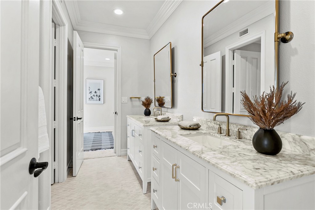 7 Kent Court Ladera Ranch, CA 92694 - Photo 43 of 49 a bathroom with double sink and mirror
