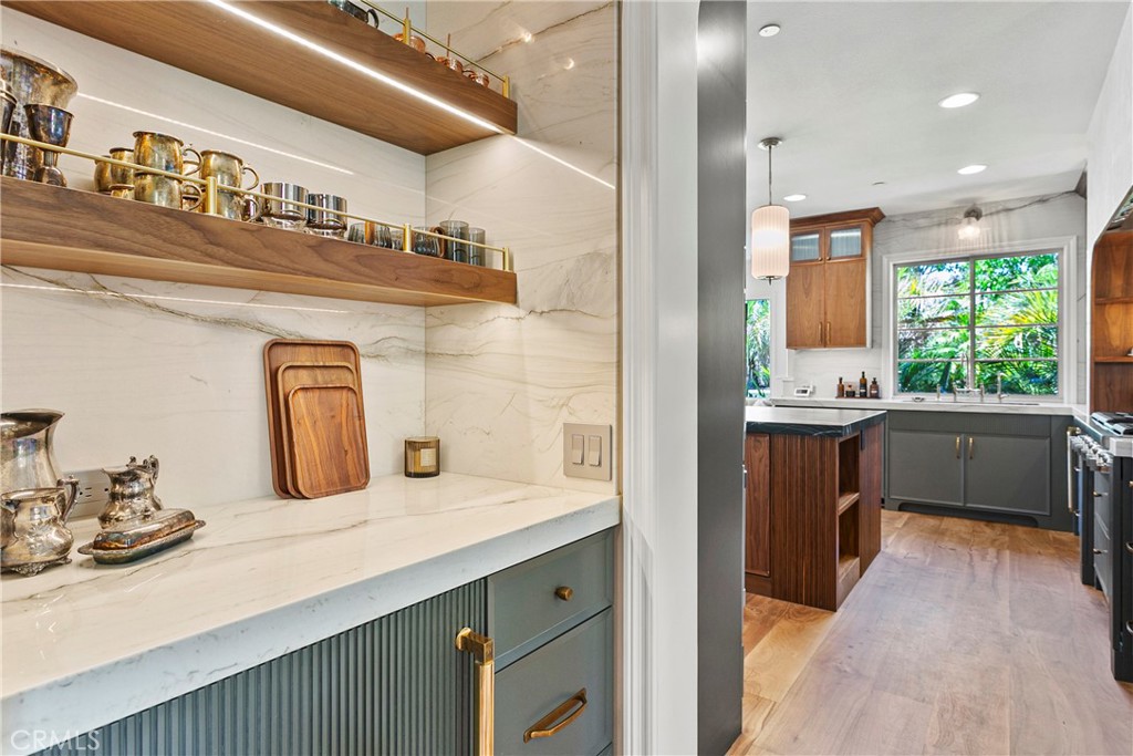 7 Kent Court Ladera Ranch, CA 92694 - Photo 10 of 49 a bathroom with a sink a large mirror and a window