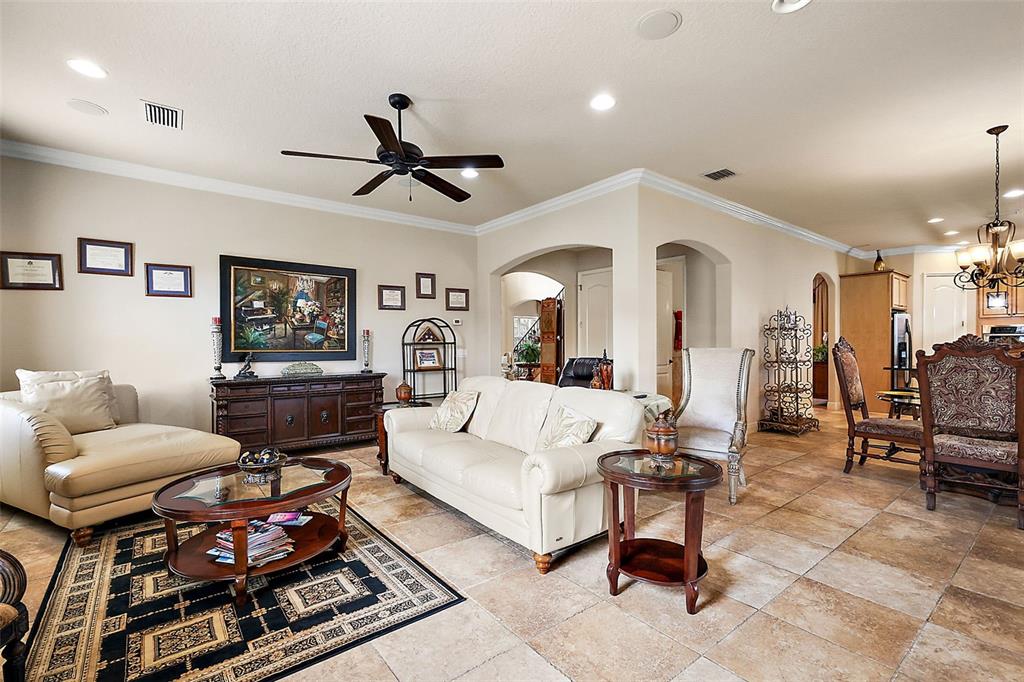 212 Crestrun Loop Leesburg, FL 34748 - Photo 13 of 47 a living room with furniture and a view of kitchen