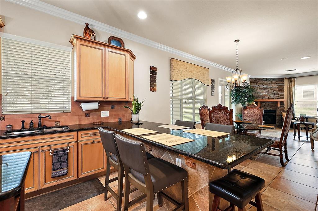 212 Crestrun Loop Leesburg, FL 34748 - Photo 21 of 47 a dining table with chairs and window