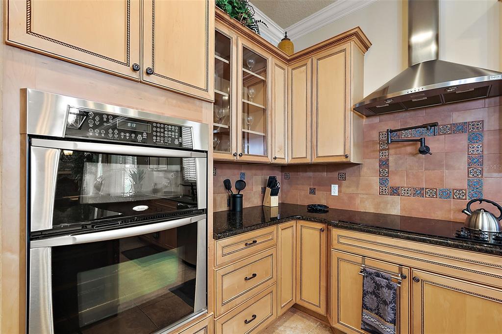 212 Crestrun Loop Leesburg, FL 34748 - Photo 23 of 47 a kitchen with stainless steel appliances granite countertop white cabinets and a counter top space