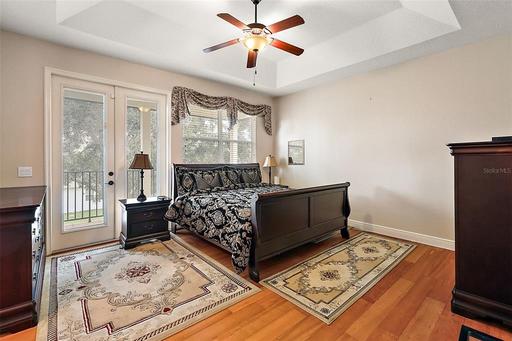 212 Crestrun Loop Leesburg, FL 34748 - Photo 26 of 47 a bedroom with bed and window