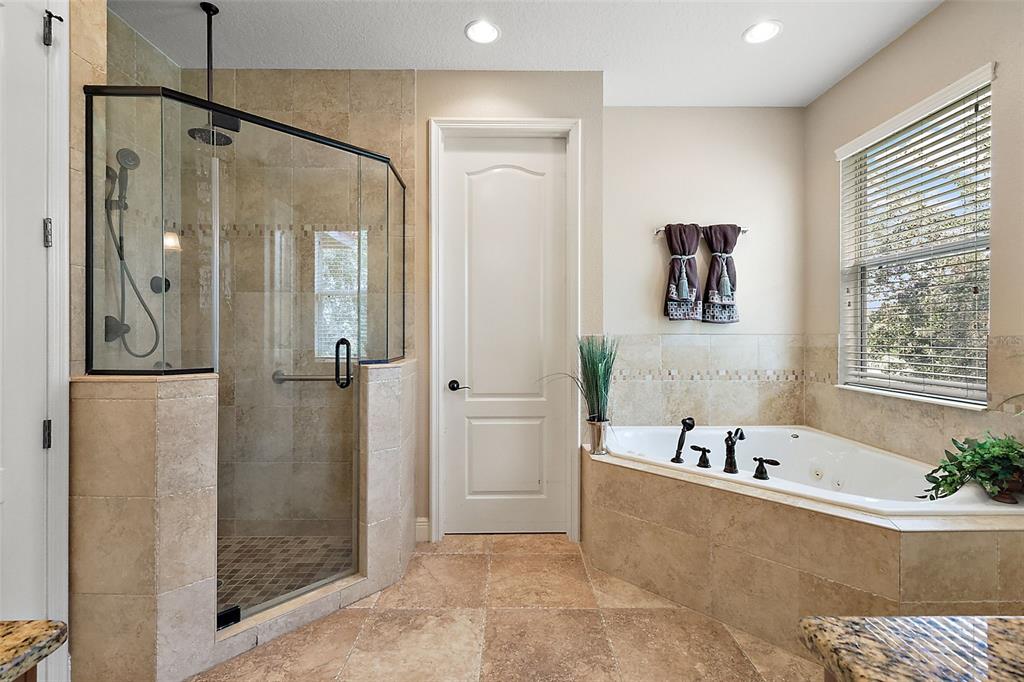 212 Crestrun Loop Leesburg, FL 34748 - Photo 28 of 47 a bathroom with a bathtub and a shower