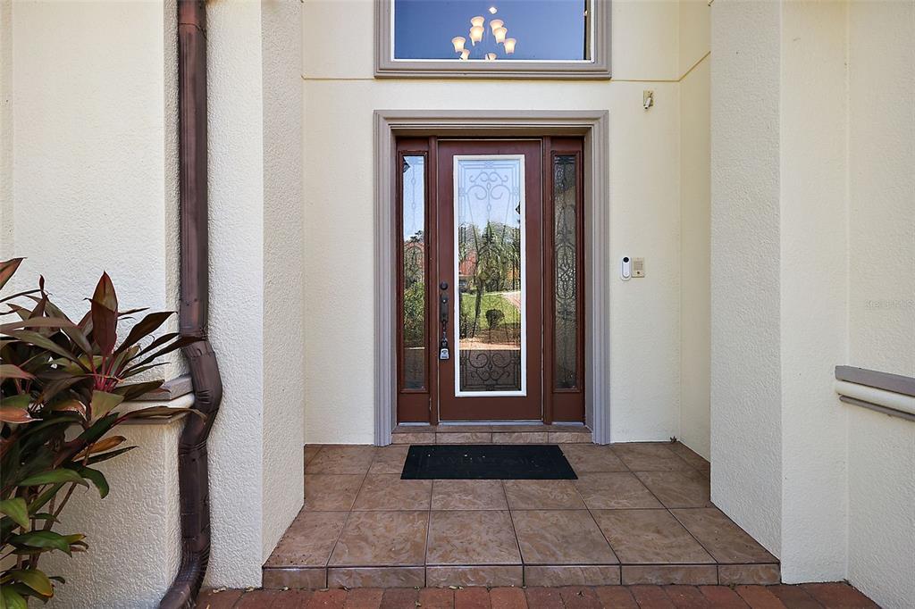 212 Crestrun Loop Leesburg, FL 34748 - Photo 3 of 47 a view of a entryway door of the house