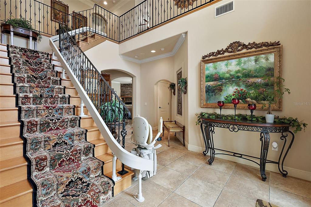 212 Crestrun Loop Leesburg, FL 34748 - Photo 4 of 47 a living room with furniture a potted plant and a rug