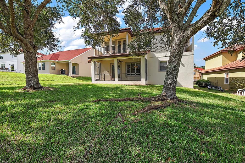 212 Crestrun Loop Leesburg, FL 34748 - Photo 44 of 47 a front view of a house with a yard