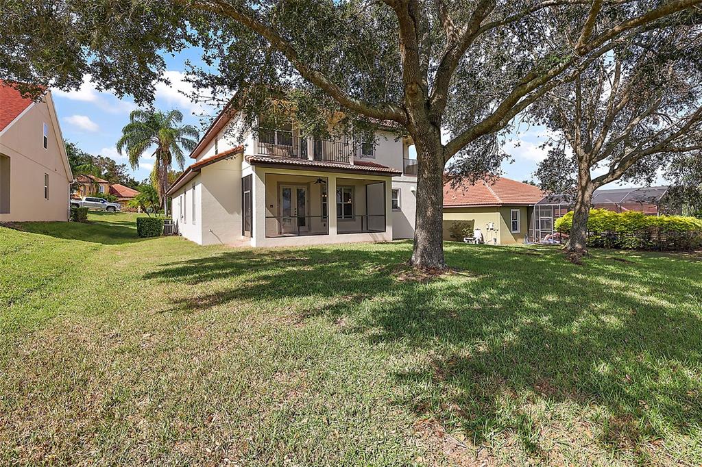 212 Crestrun Loop Leesburg, FL 34748 - Photo 45 of 47 a front view of a house with a garden
