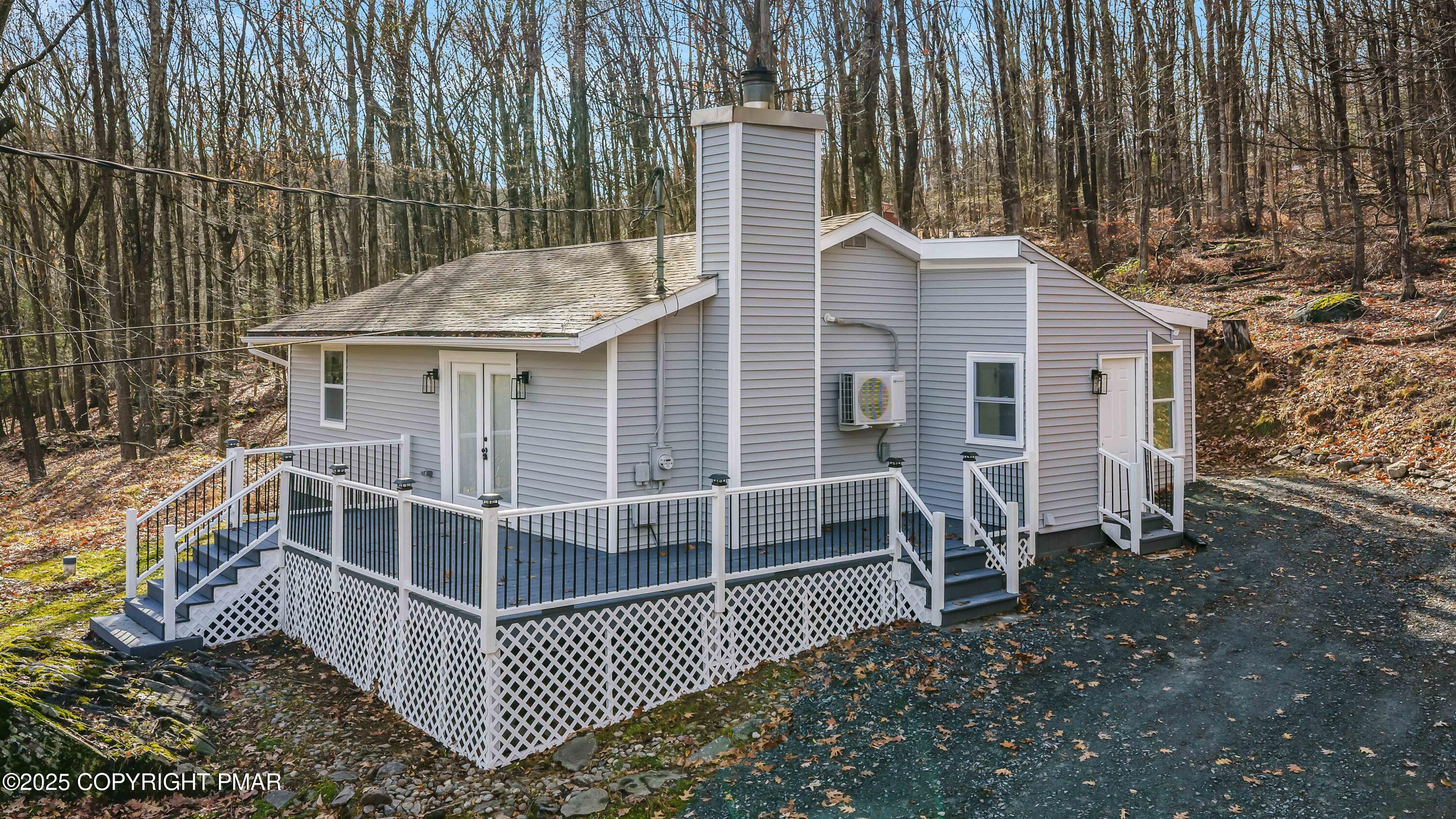 a view of a house with backyard and porch