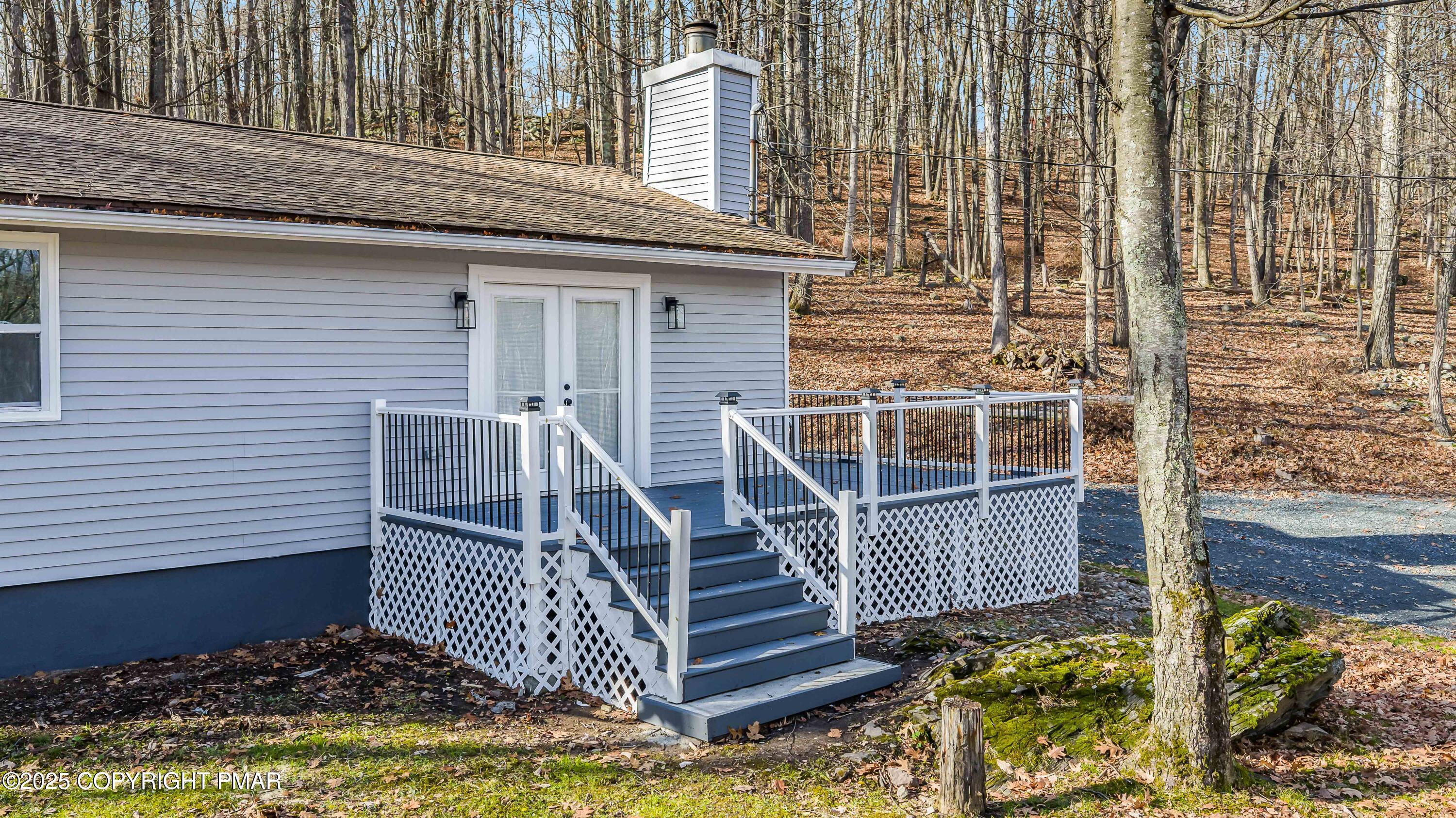 218 Vista Road Cresco, PA 18326 - Photo 12 of 54 a front view of a house with a yard