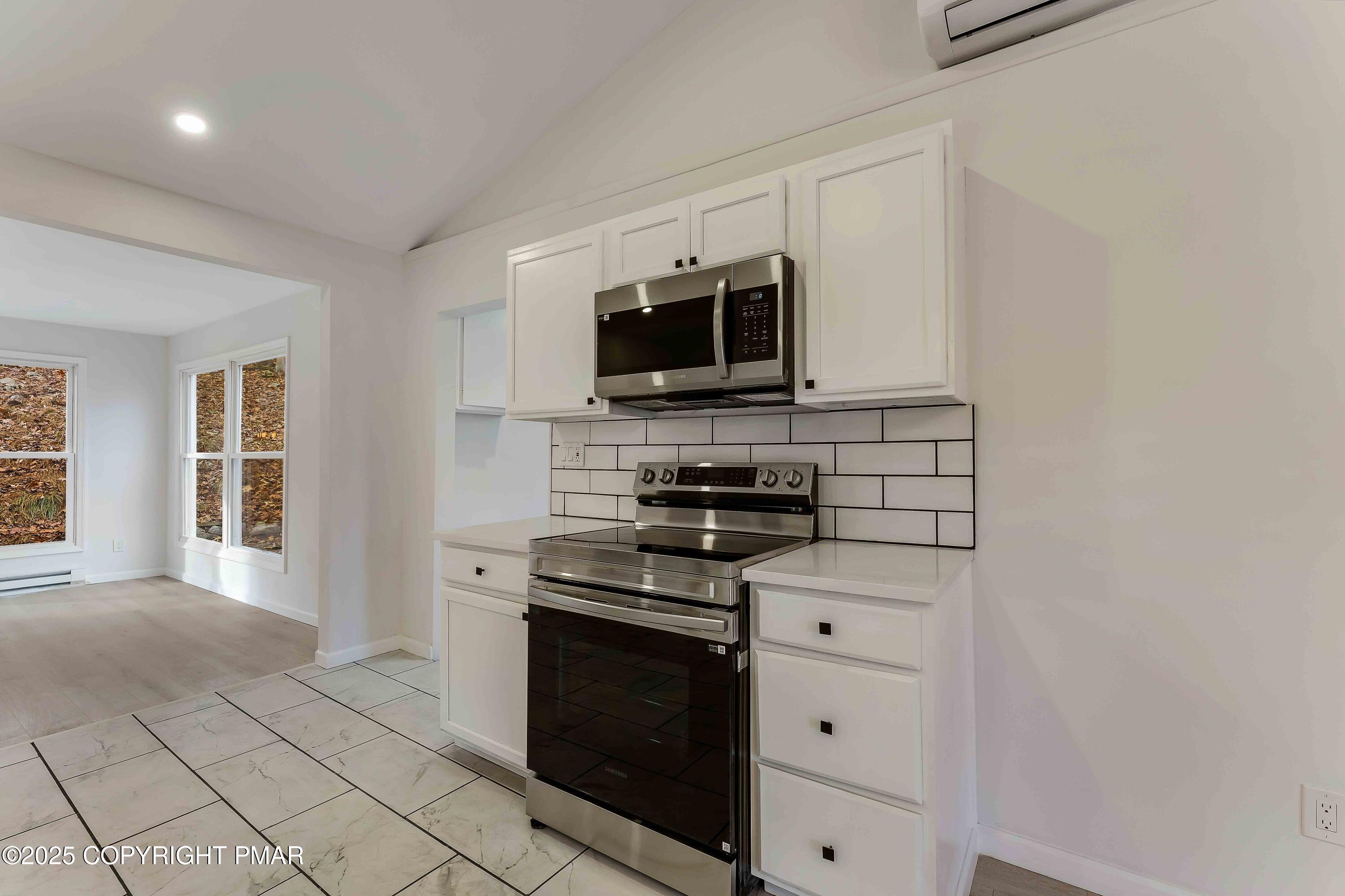 218 Vista Road Cresco, PA 18326 - Photo 26 of 54 a kitchen with stainless steel appliances a stove microwave and refrigerator