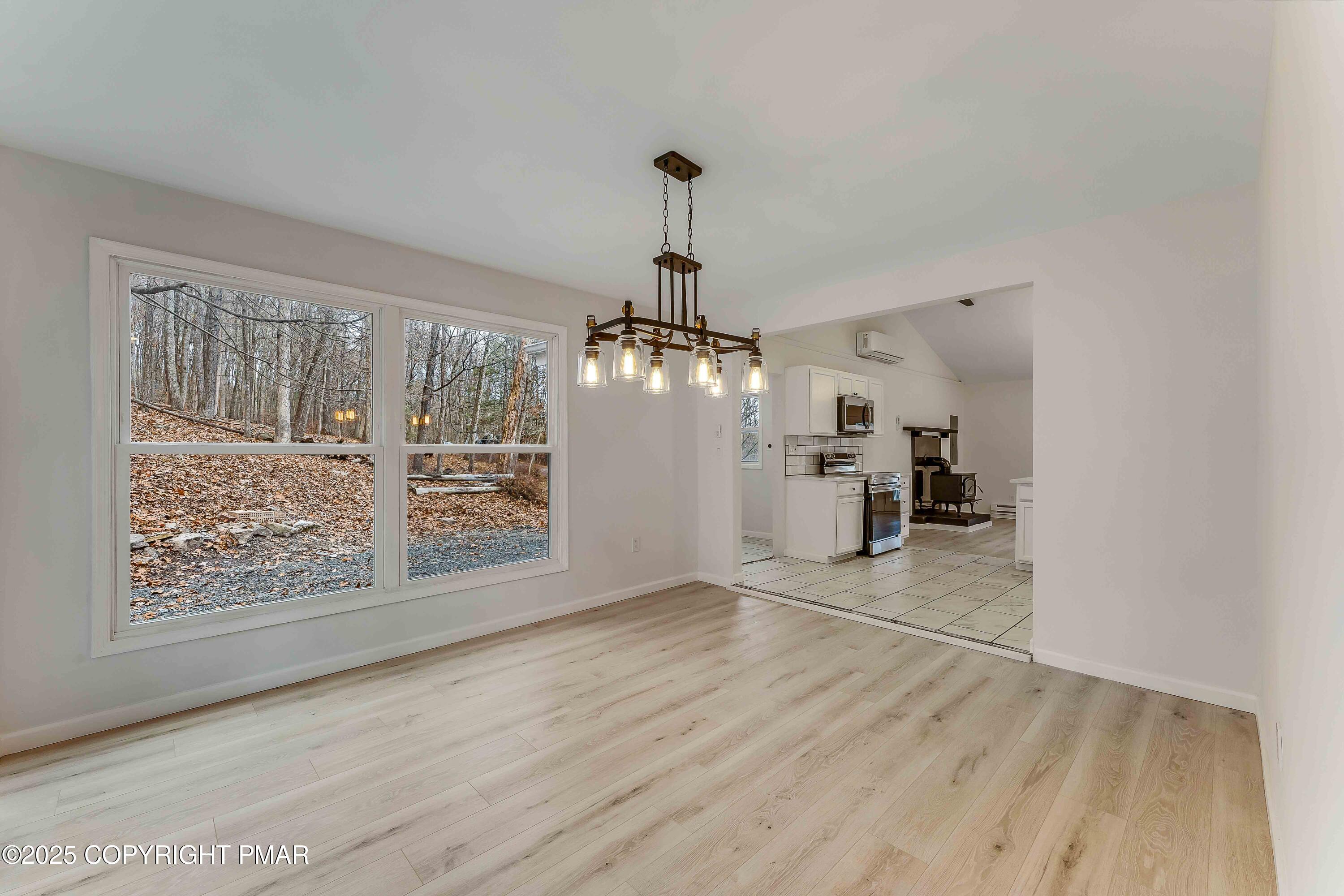 218 Vista Road Cresco, PA 18326 - Photo 28 of 54 wooden floor in an empty room with a window