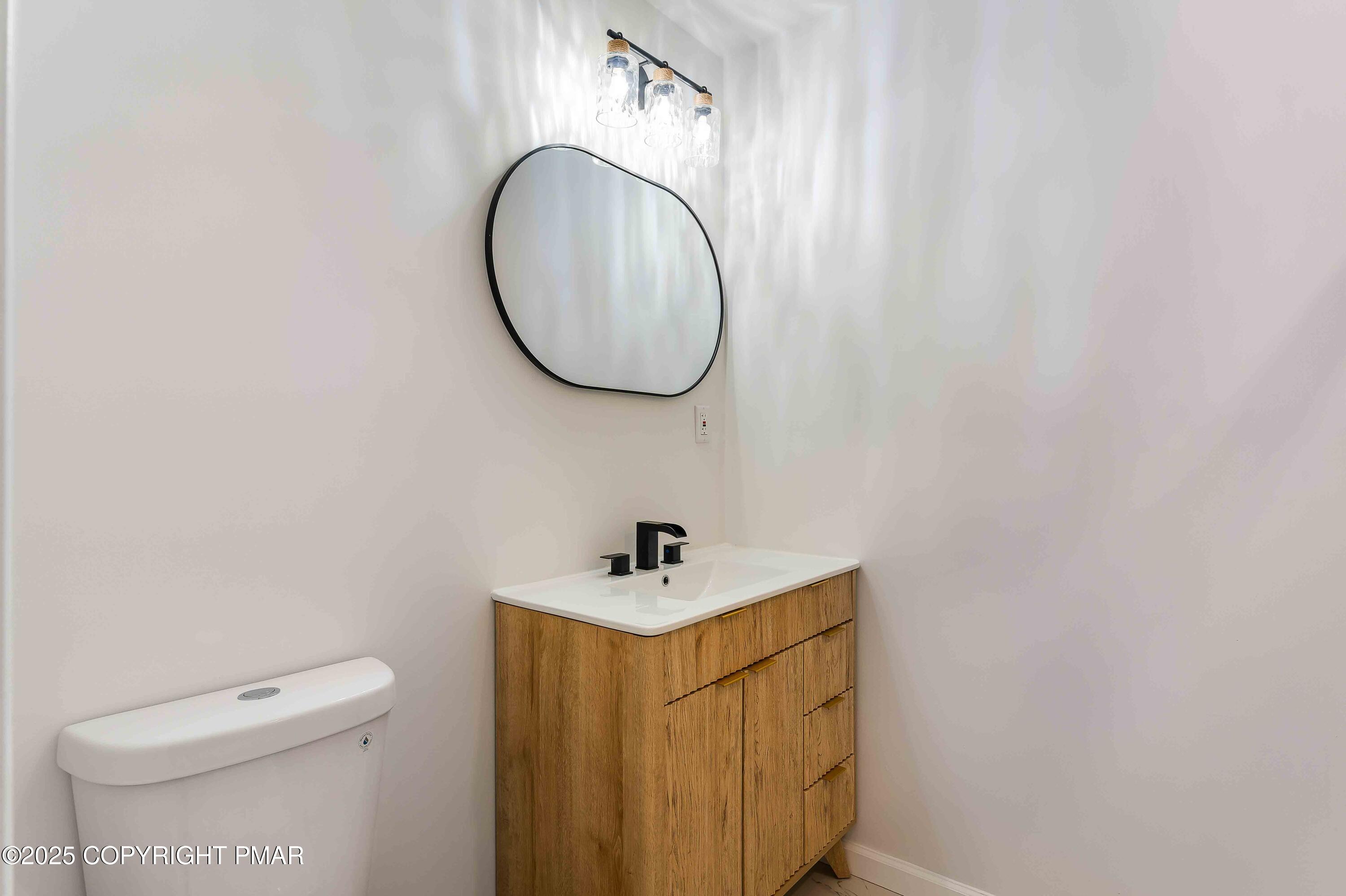 218 Vista Road Cresco, PA 18326 - Photo 36 of 54 a bathroom with a sink a toilet and a mirror