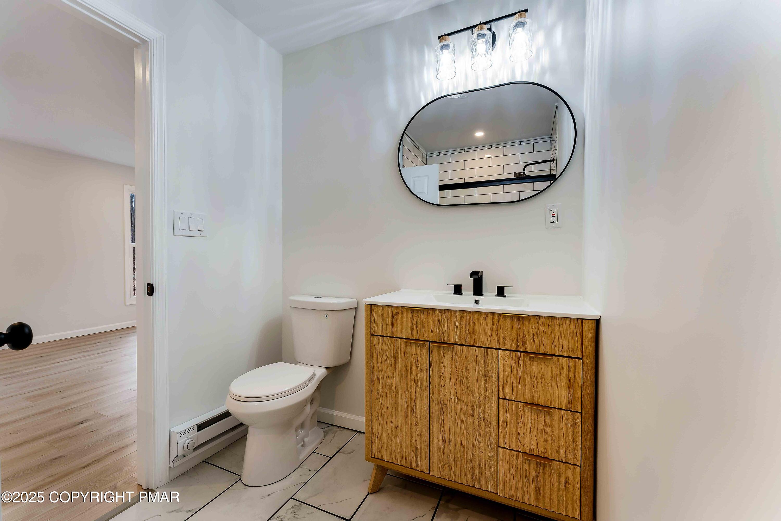 218 Vista Road Cresco, PA 18326 - Photo 8 of 54 a bathroom with a toilet a sink and mirror
