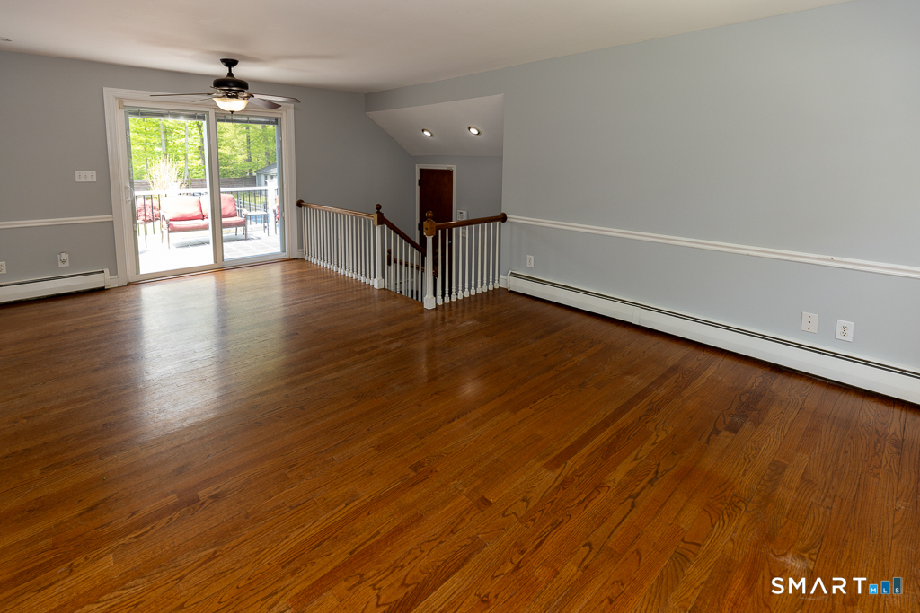 49 Kelseytown Road Clinton, CT 06413 - Photo 17 of 40 Spacious family room with sliders to back patio . . .
