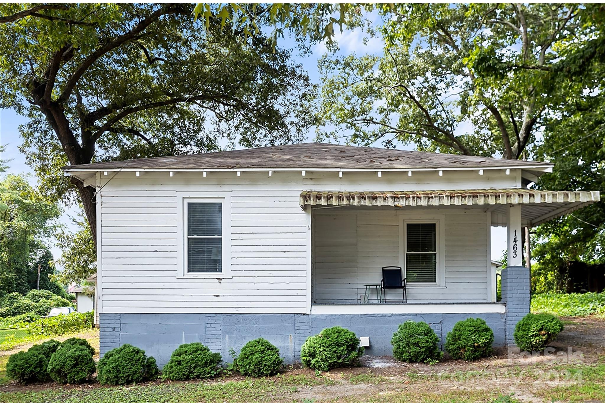 1463 Rhodes Rhyne Road Lincolnton, NC 28092 - Photo 5 of 24 a front view of a house with a yard and garage