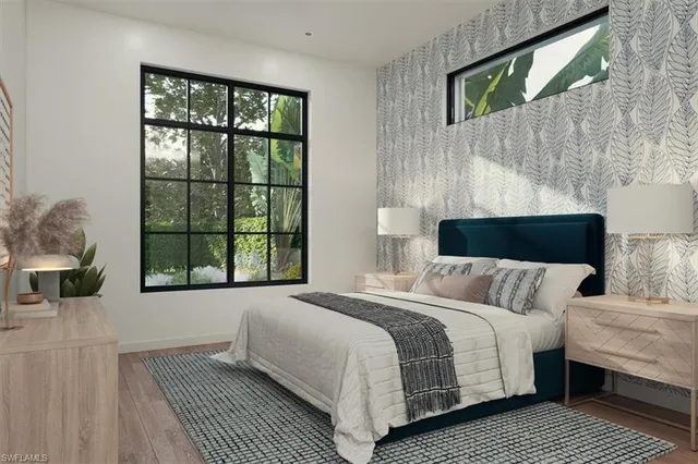 a bedroom with a bed lamp and a large window