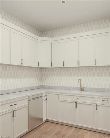 a kitchen with white cabinets