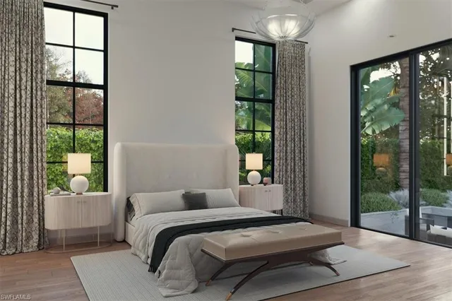 a bedroom with a large bed and a window