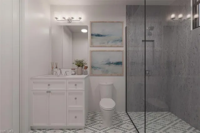 a bathroom with a toilet a sink and glass door