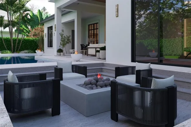 a dining room with fireplace furniture and a potted plant