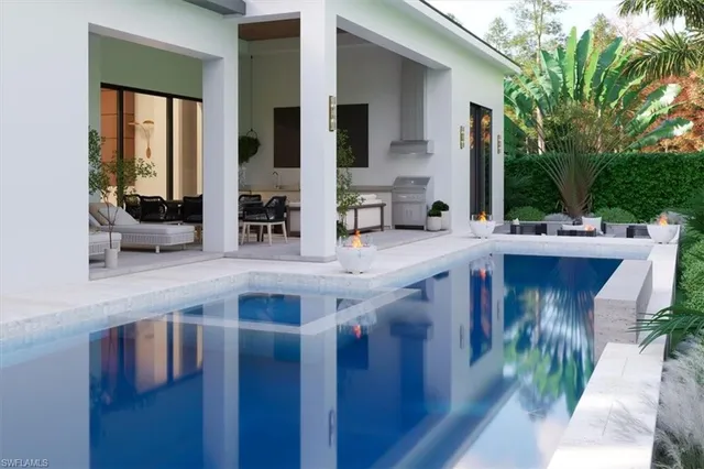 a kitchen with a sink and refrigerator