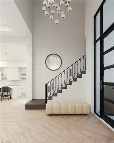 a view of entryway and hall with wooden floor