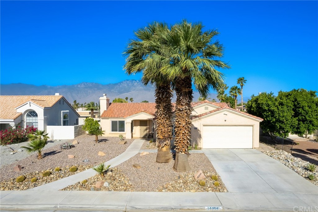 30399 Sterling Road Cathedral City, CA 92234 - Photo 1 of 1 a front view of a house with a yard and garage