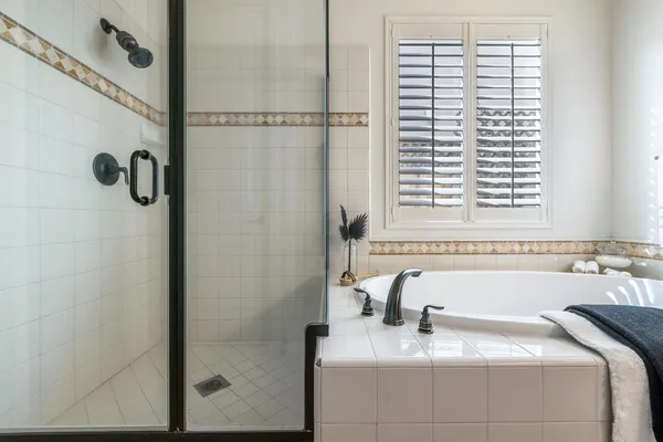 a bathroom with a bathtub and a window