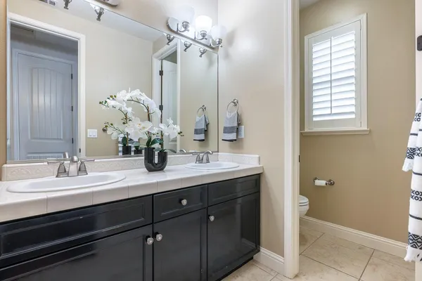 a bathroom with a shower and a bath tub