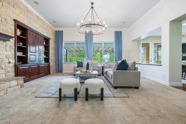 a living room with furniture and a fireplace