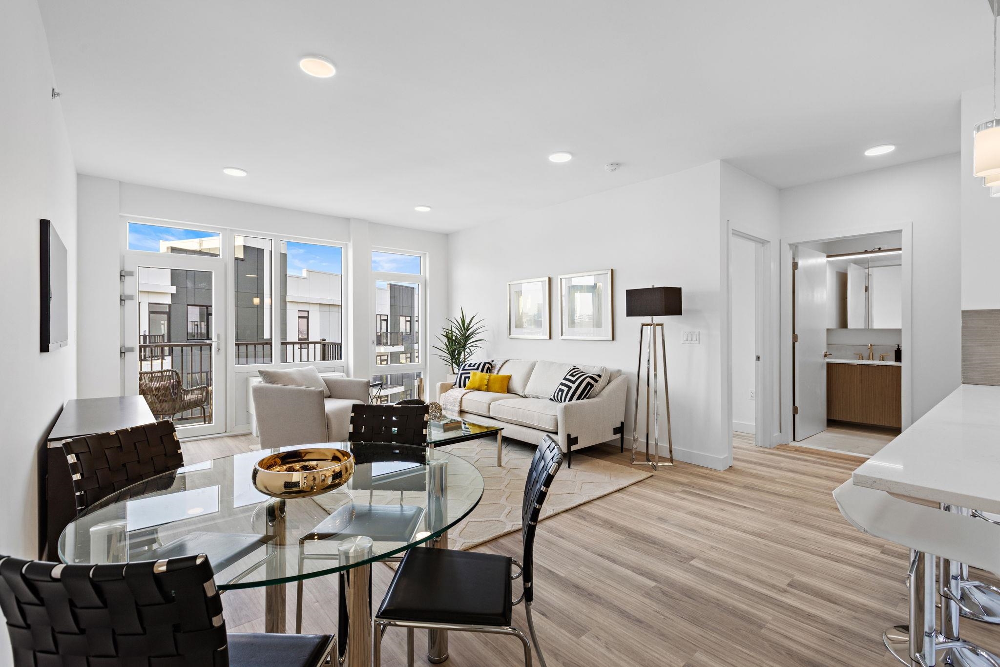 5711 John F. Kennedy Boulevard, Unit 306 North Bergen, NJ 07047 - Photo 8 of 31 a living room with furniture and wooden floor