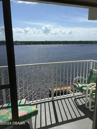 a view of balcony with furniture